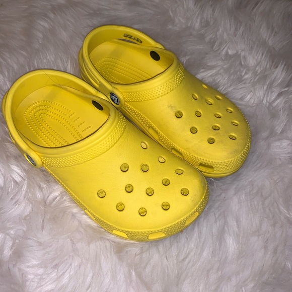 yellow crocs with pins